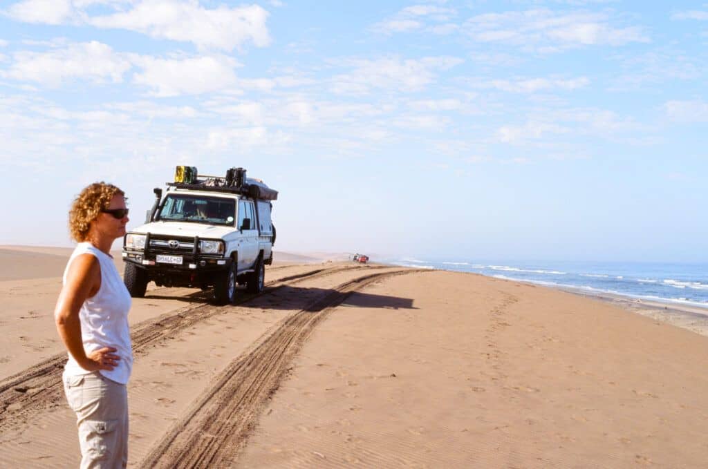 a Land Cruiser 79 series driving in th dunes of Iona National Park